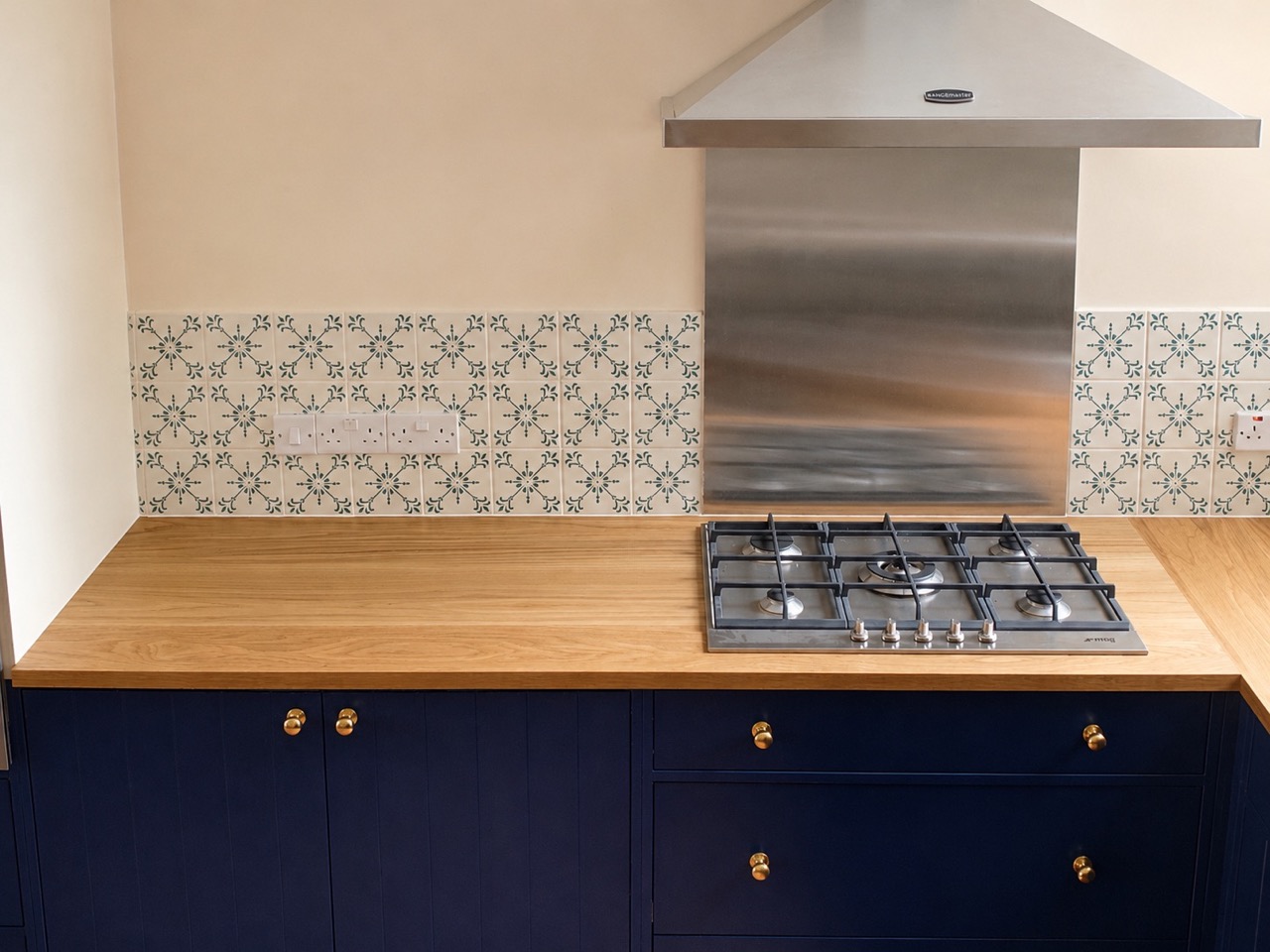 Oak worktop and retained tiles